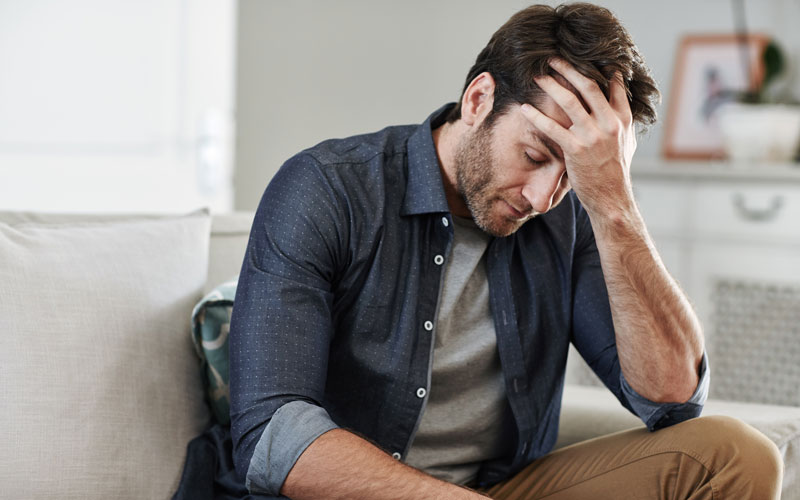 man looking tired or upset